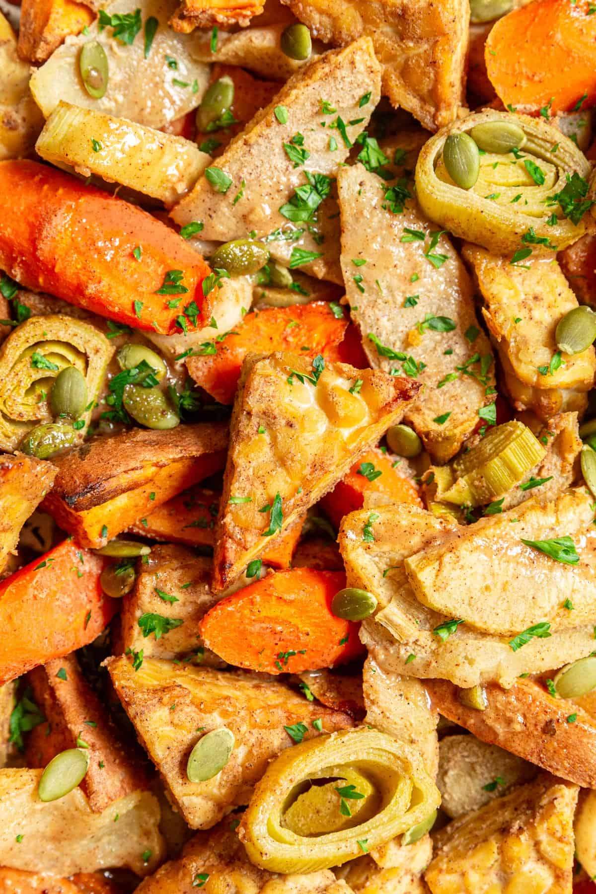 A sheet pan full of roasted tempeh and vegetables.