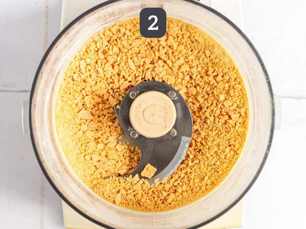 Vegan Butterfingers Step 2 - pulse the cornflakes in a food processor.