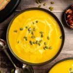 Vegan Butternut Squash Leek Soup In a bowl garnished with pumpkin seeds.