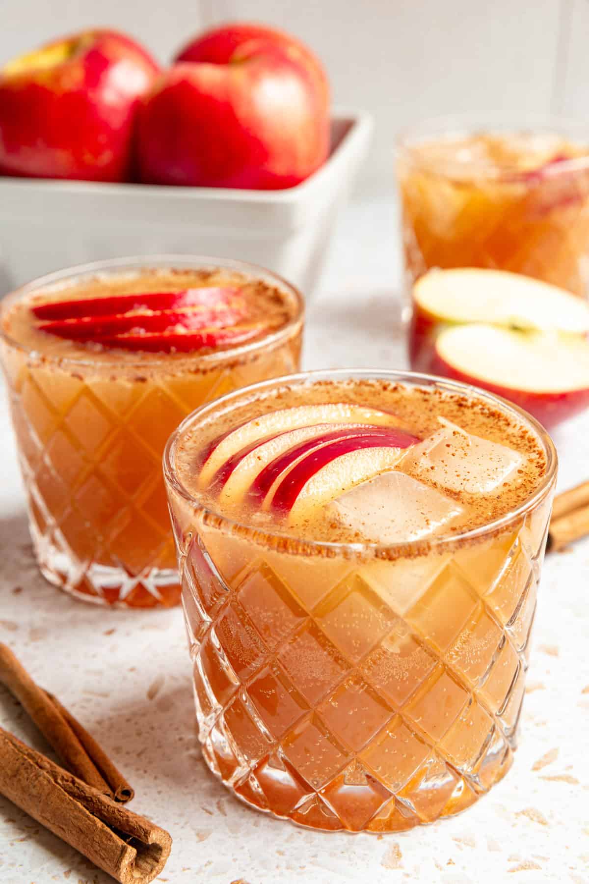 Three apple mocktails, ready to serve.