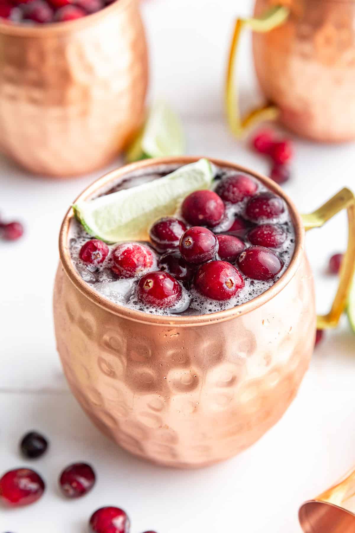 A mule glass with a cranberry mocktail.