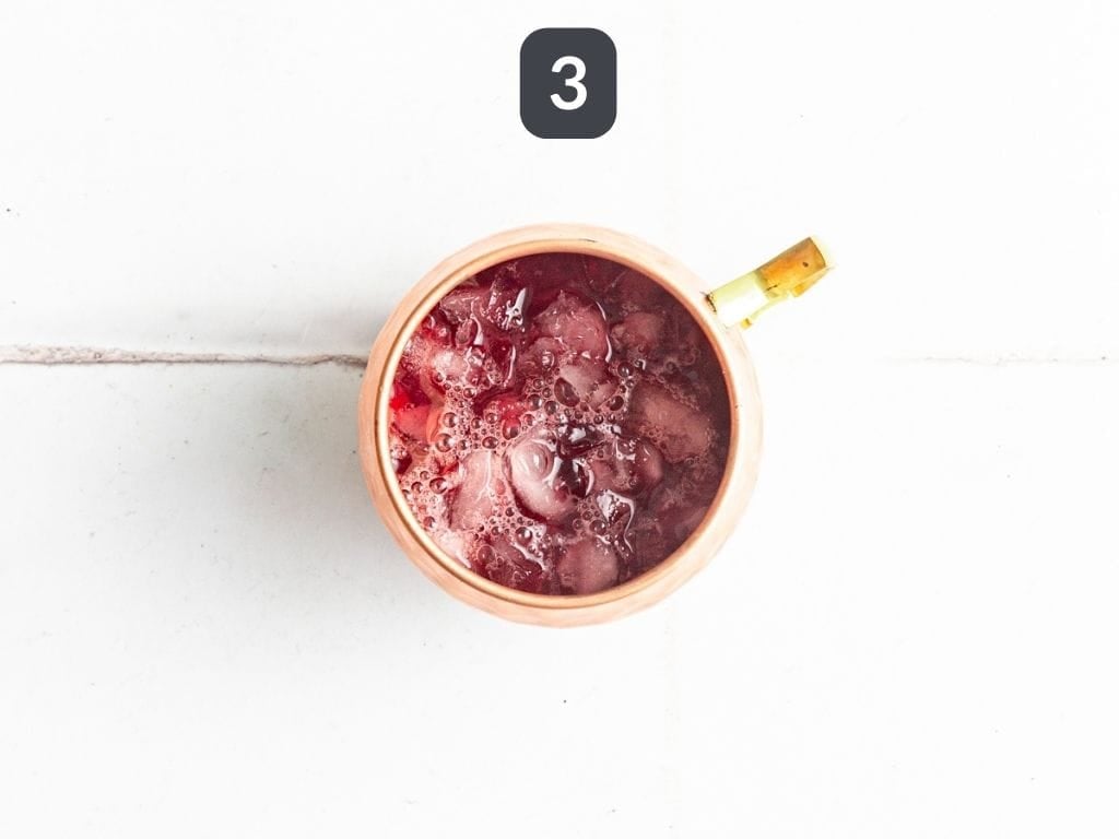 Cranberry Mule Mocktail Step 3 - pour in the cranberry mixture.