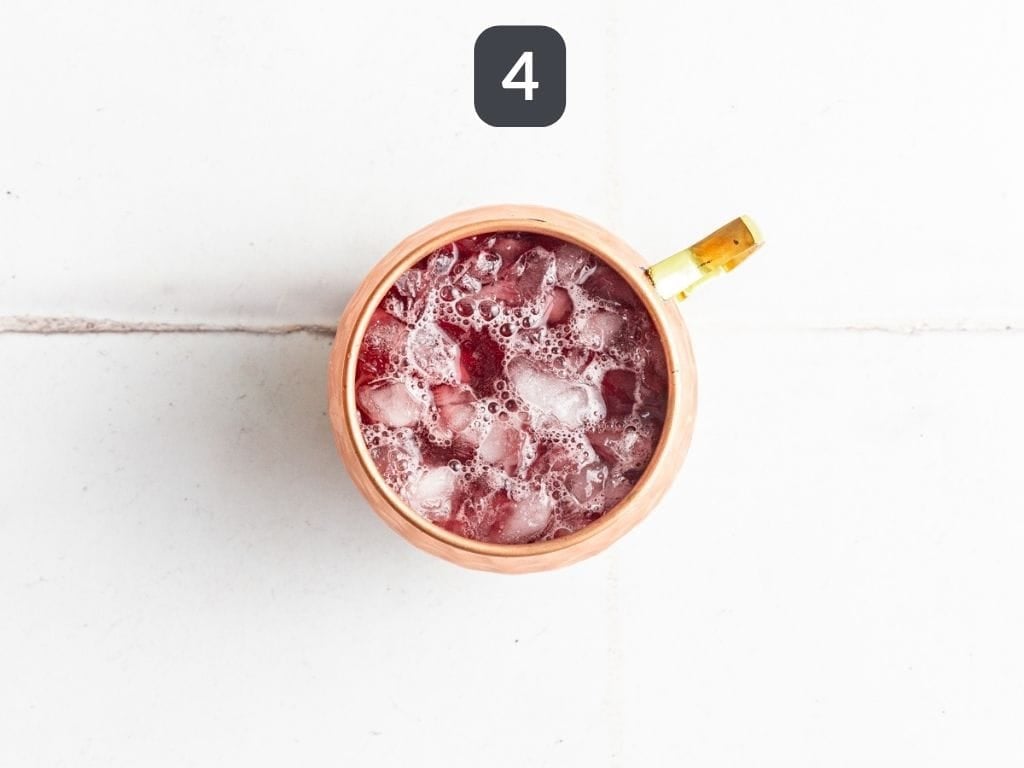 Cranberry Mule Mocktail Step 4 - add the kombucha.