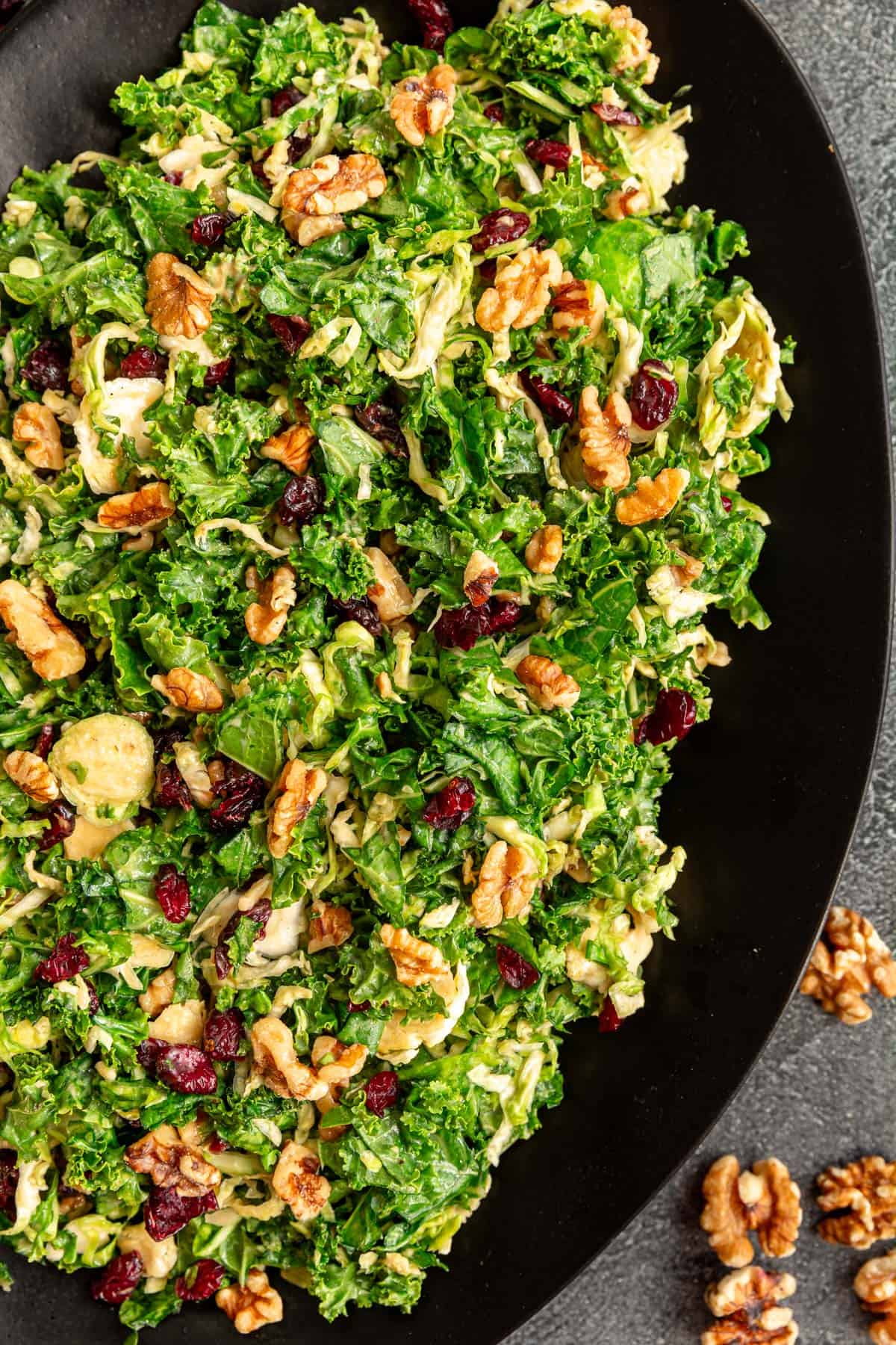 A platter of Vegan Kale Brussels Sprouts Cranberry Salad.