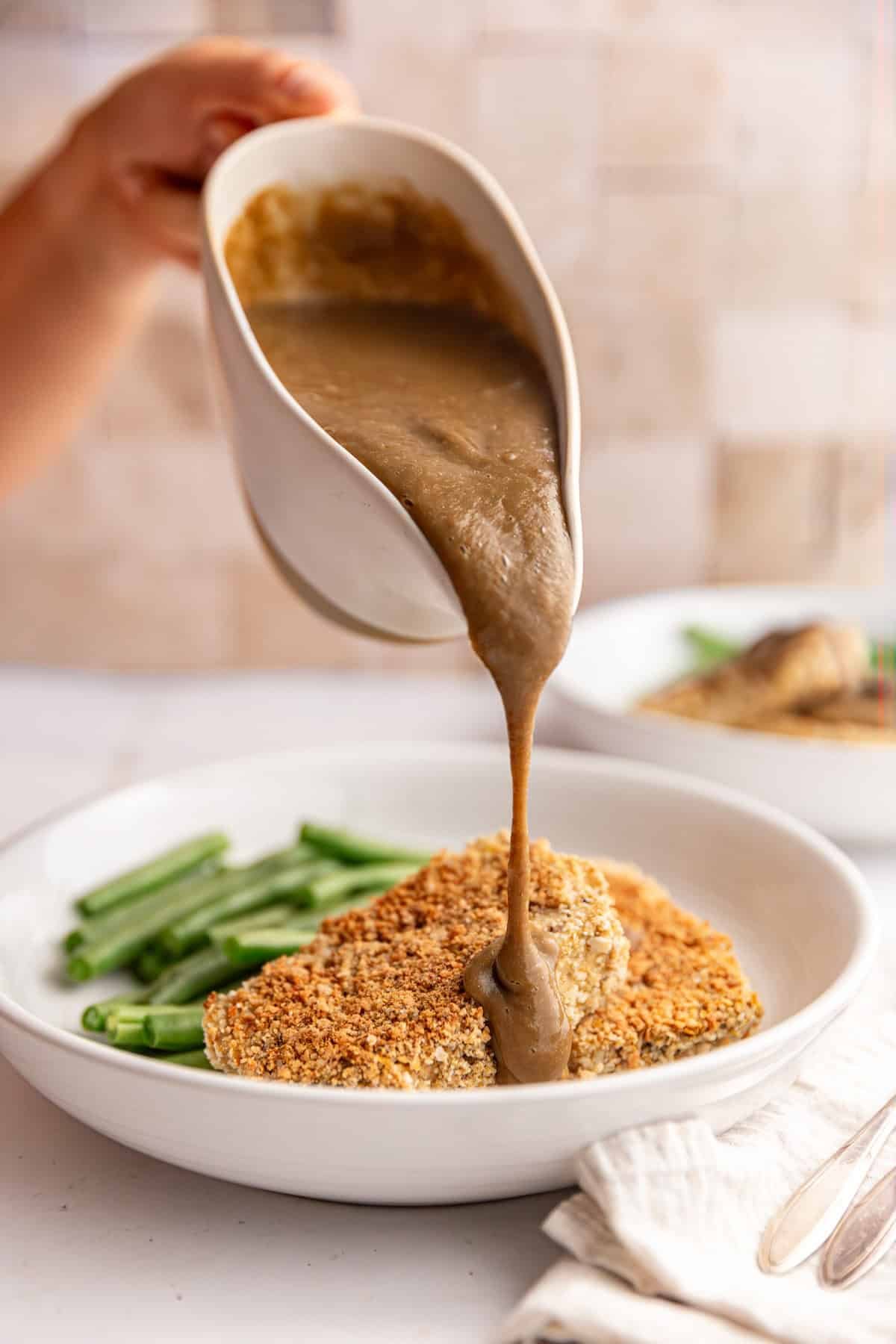 Mushroom gravy poured onto tofu.