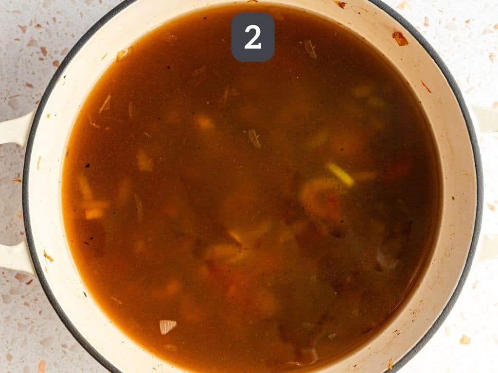 Vegan Chicken Lemon Rice Soup Step 2 - add the broth and bring to a simmer.