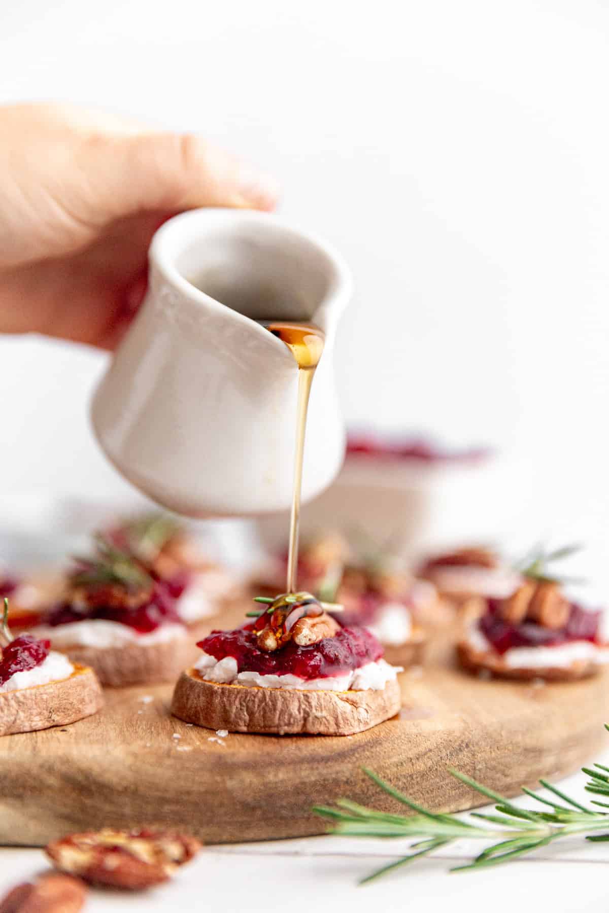 Maple syrup drizzled onto a sweet potato crostini.