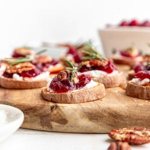 A sweet potato crostini on a serving board.