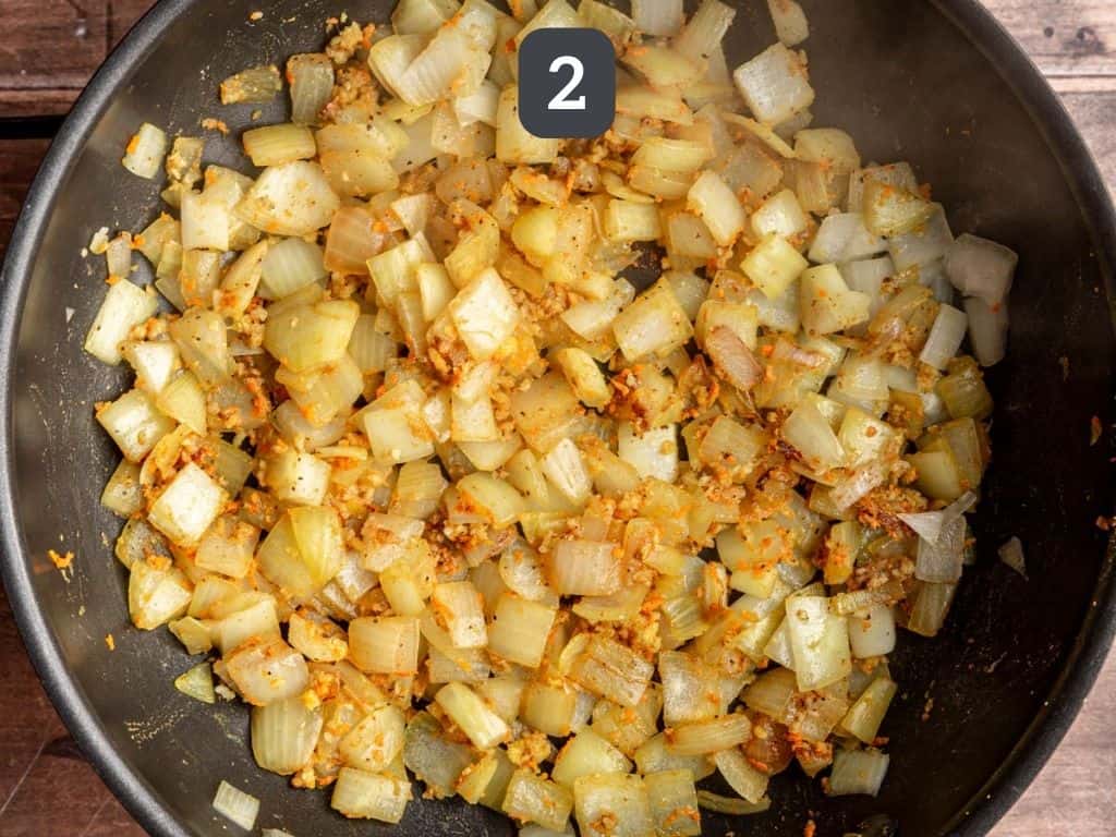 Vegan chicken curry step 2 - add the spices and cook.