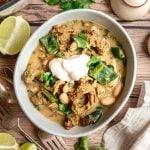 A bowl of vegan white chicken chili, served with a dollop of non-dairy yogurt.