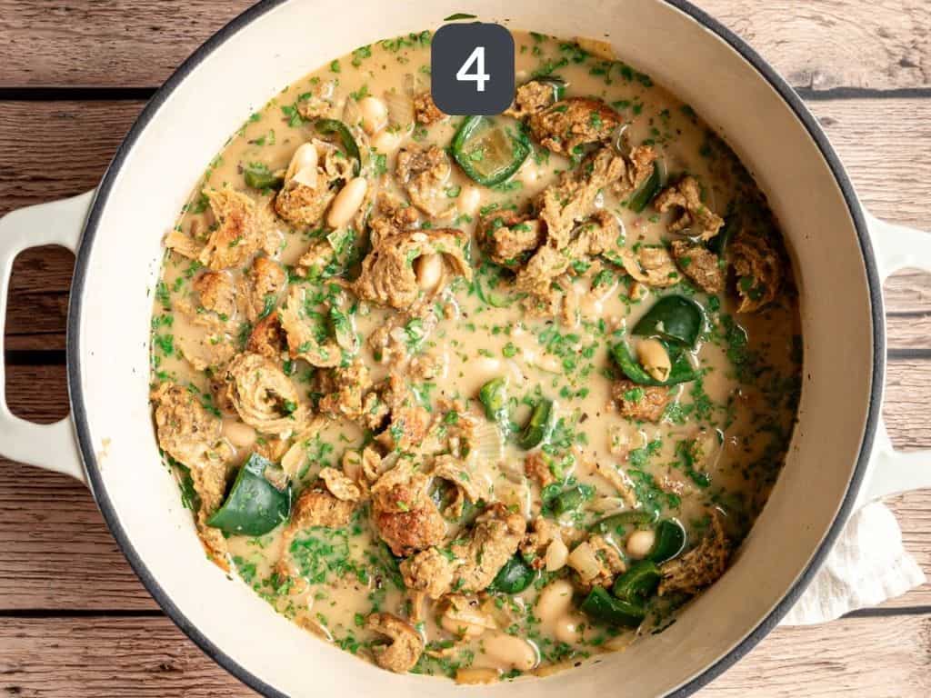 Vegan white chicken chili step 4 - stir in the yogurt, lime juice, and cilantro.