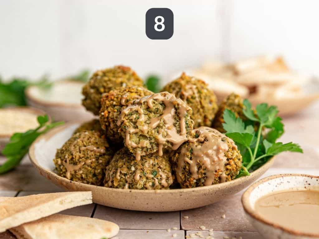 Vegan Oil-Free Falafel Step 8 - falafel with tahini drizzle.