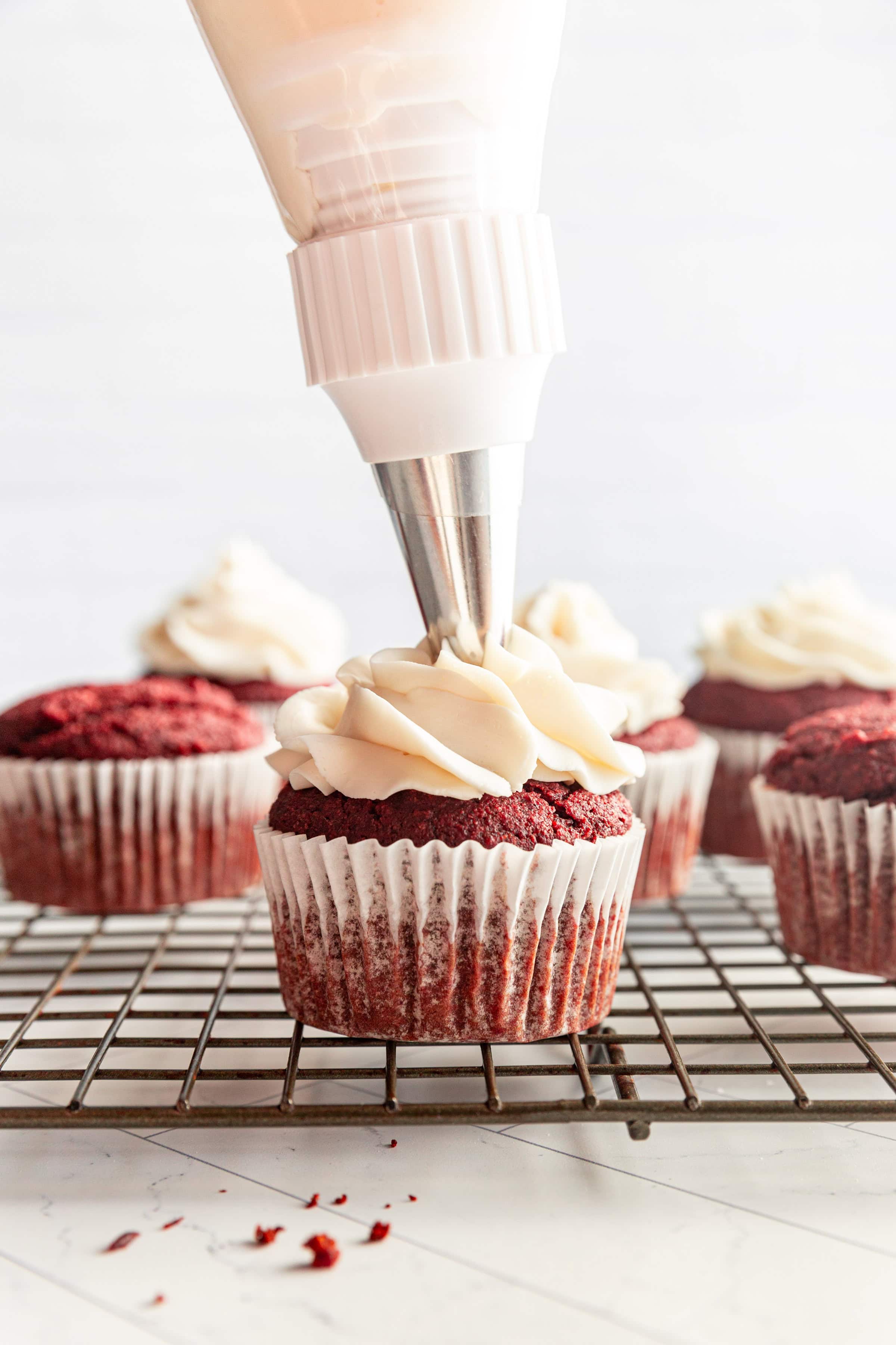 Gluten-Free Vegan Red Velvet Cupcakes being frosted