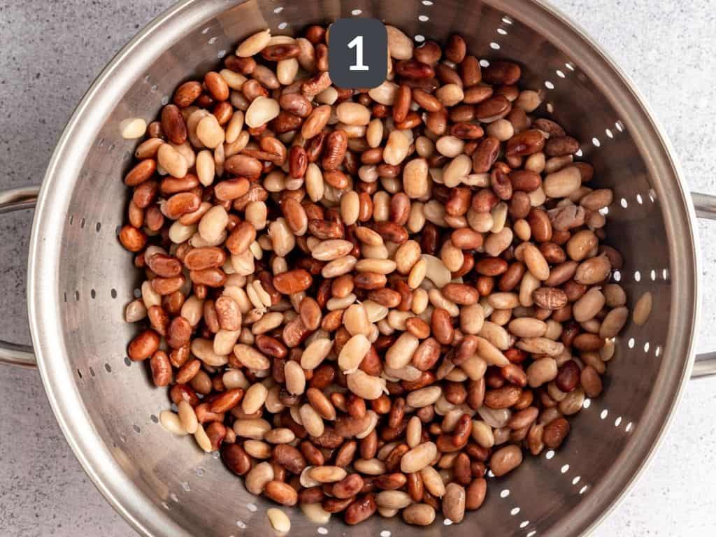 Soaked pinto beans in a colander. 