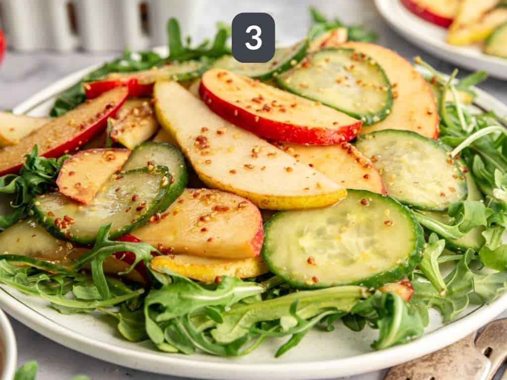 Apple Pear Cucumber Salad Step 3 - serve over arugula.