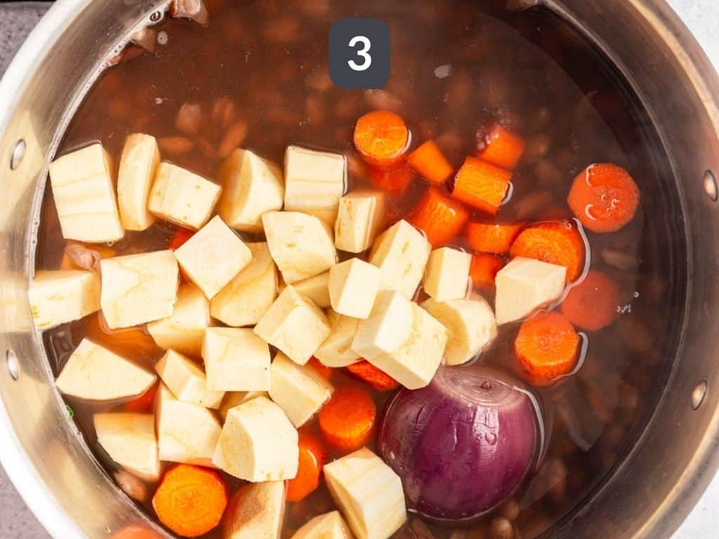 Carrots and parsnips added to the pot.