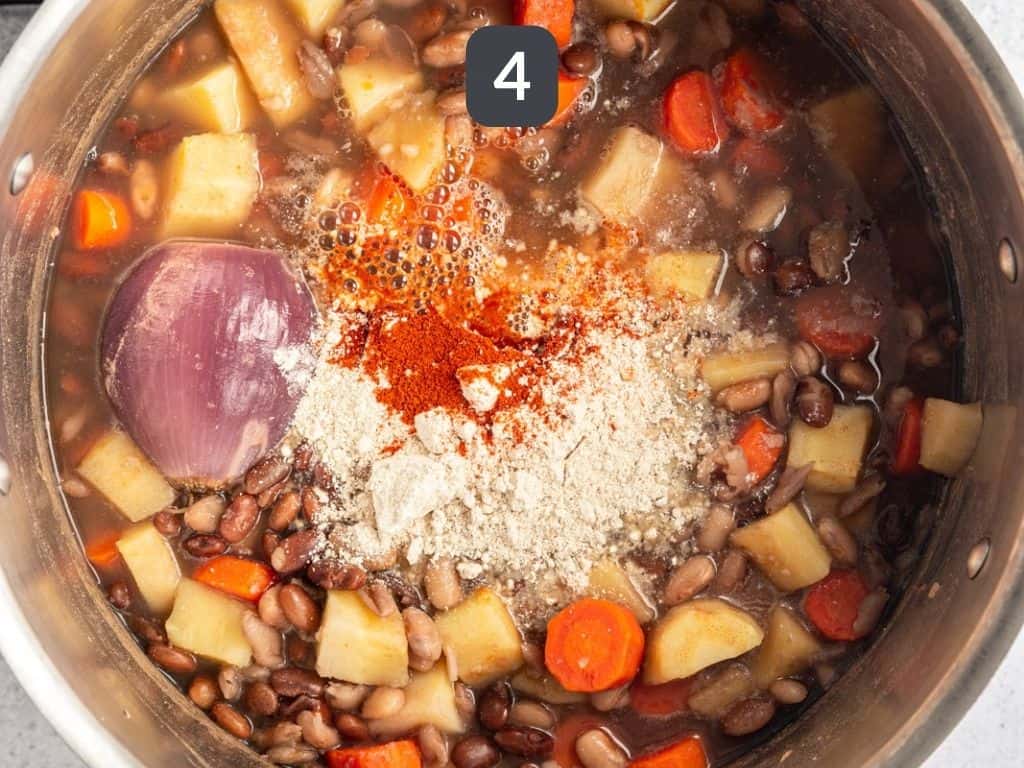 Flour and paprika added to pot.