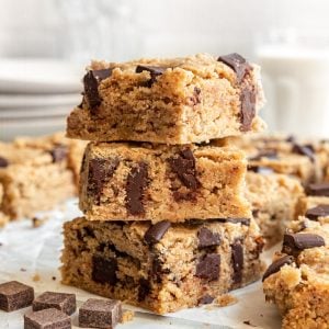 A stack of healthy vegan chocolate chip chickpea blondies.