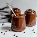 Three jars of chocolate pudding.