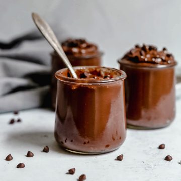 Three jars of chocolate pudding.