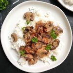 A plate of Hungarian Paprika Mushrooms served over rice.