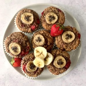 A plate of plant-based strawberry banana muffins.
