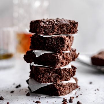 A stack of vegan bourbon brownies.