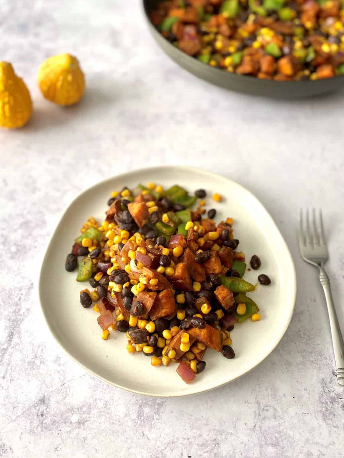 A plate of sweet potato black bean hash, ready to serve.