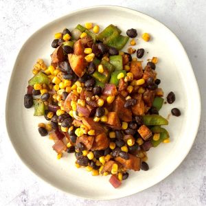 A plate of sweet potato black bean hash, ready to serve.