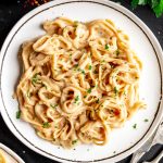 A plate of pasta tossed with vegan béchamel sauce.