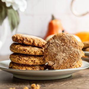 A stack of vegan pumpkin snickerdoodles on a plate.