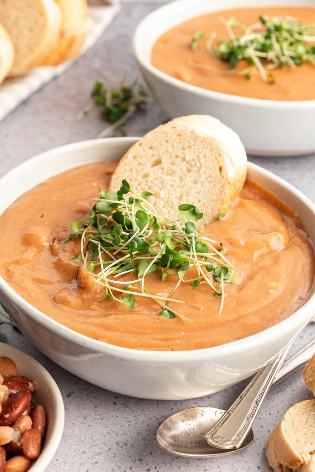 Easy Vegan Pinto Bean Soup served with fresh bread.
