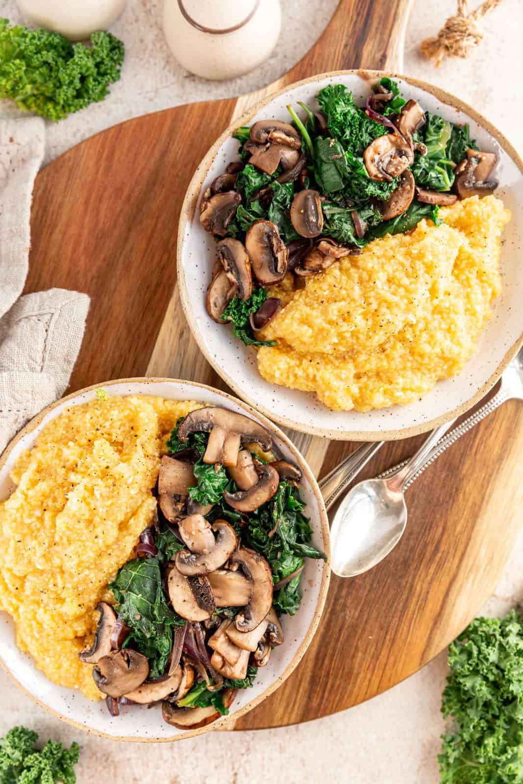 Creamy Vegan Polenta with Mushrooms Spinach and Kale served for breakfast