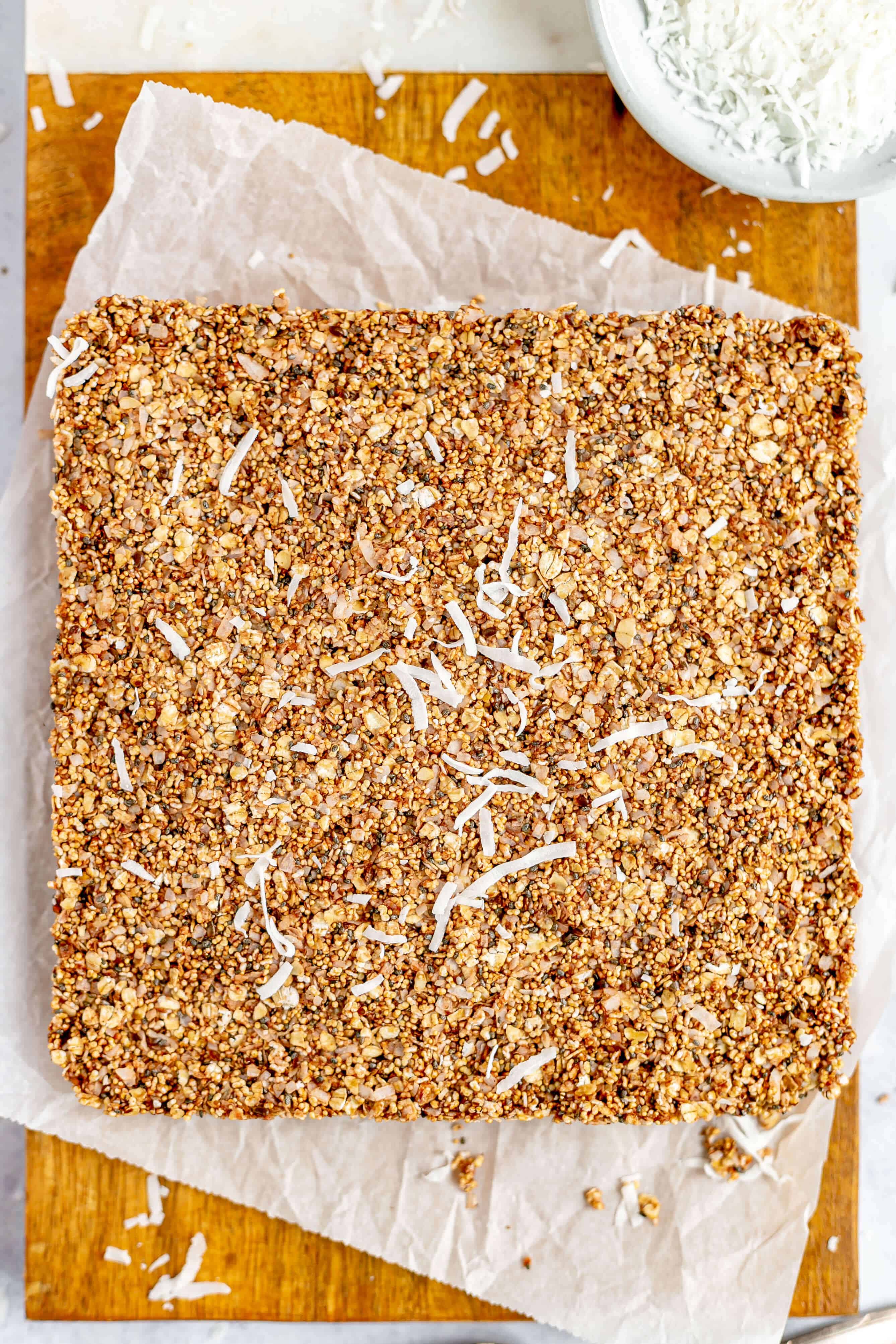 Coconut Pulp Granola Bars unsliced on cutting board