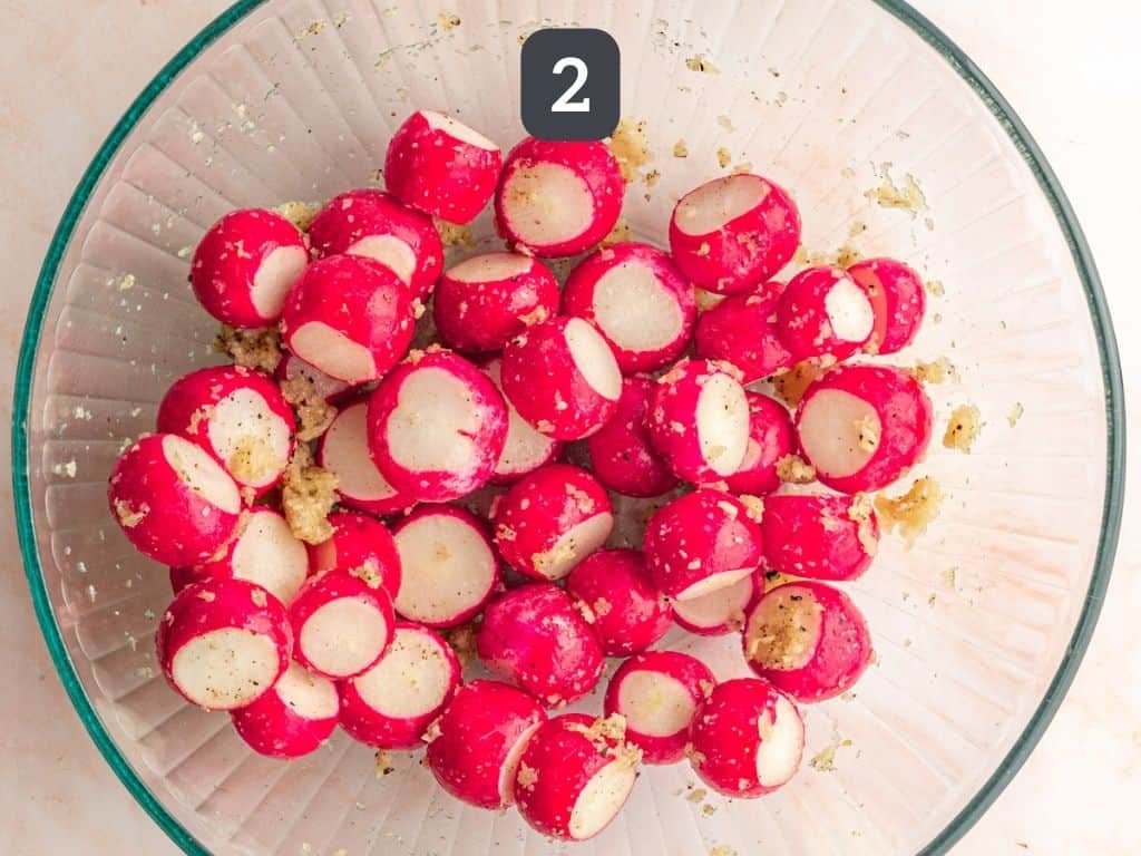 Garlic Roasted Radishes Step 2 - toss radishes with garlic.