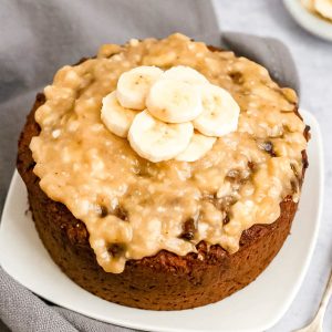 Banana cake with banana glaze, topped with banana slices.