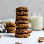 A stack of seven sweet potato pecan cookies.