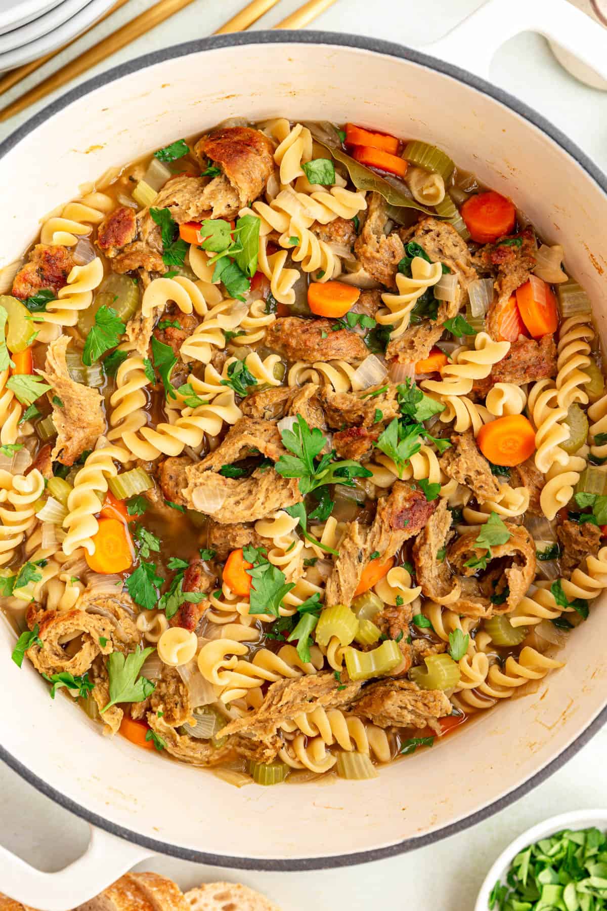 A pot of freshly cooked vegan chicken noodle soup.