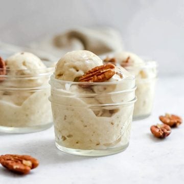 Three small mason jars filled with bourbon pecan nice cream.