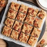A tray of maple pecan blondies, cut into squares.