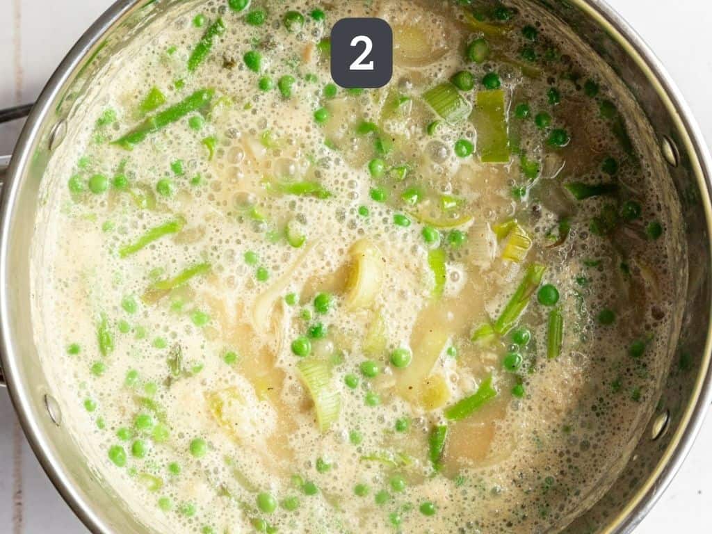 Vegan Asparagus Soup Step 2 - add the asparagus, peas, and liquids and bring to a boil.