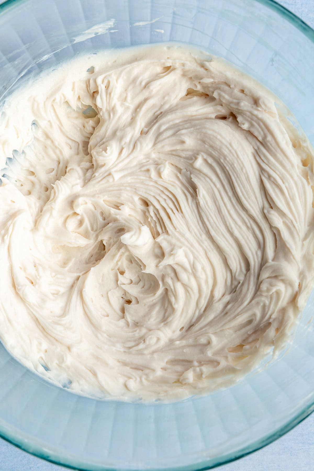 A bowl of freshly whipped vegan cream cheese frosting.
