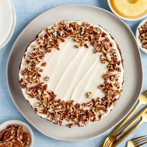 A freshly iced vegan hummingbird cake, ready to serve.