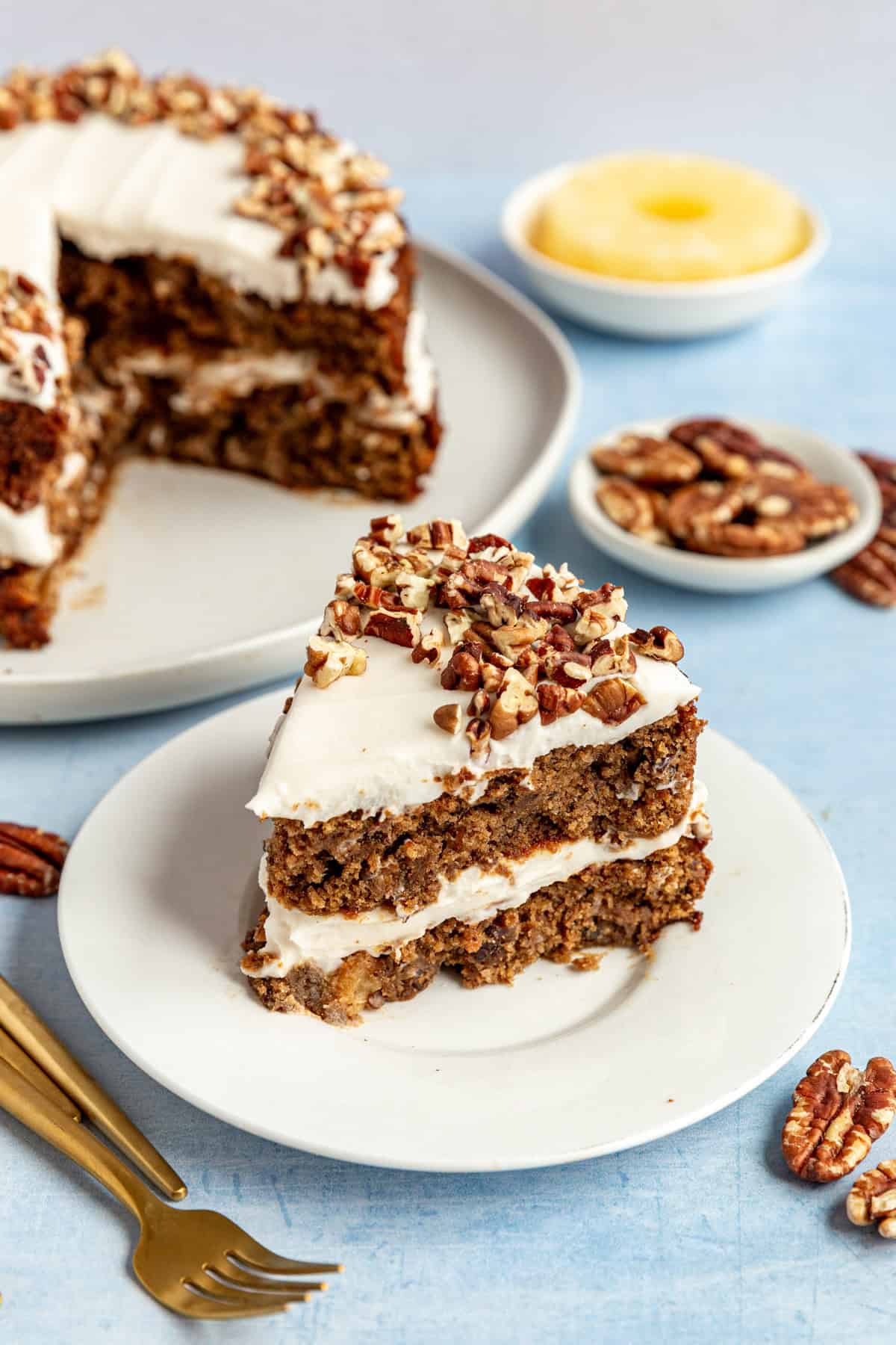 A slice of vegan hummingbird cake, ready to serve.
