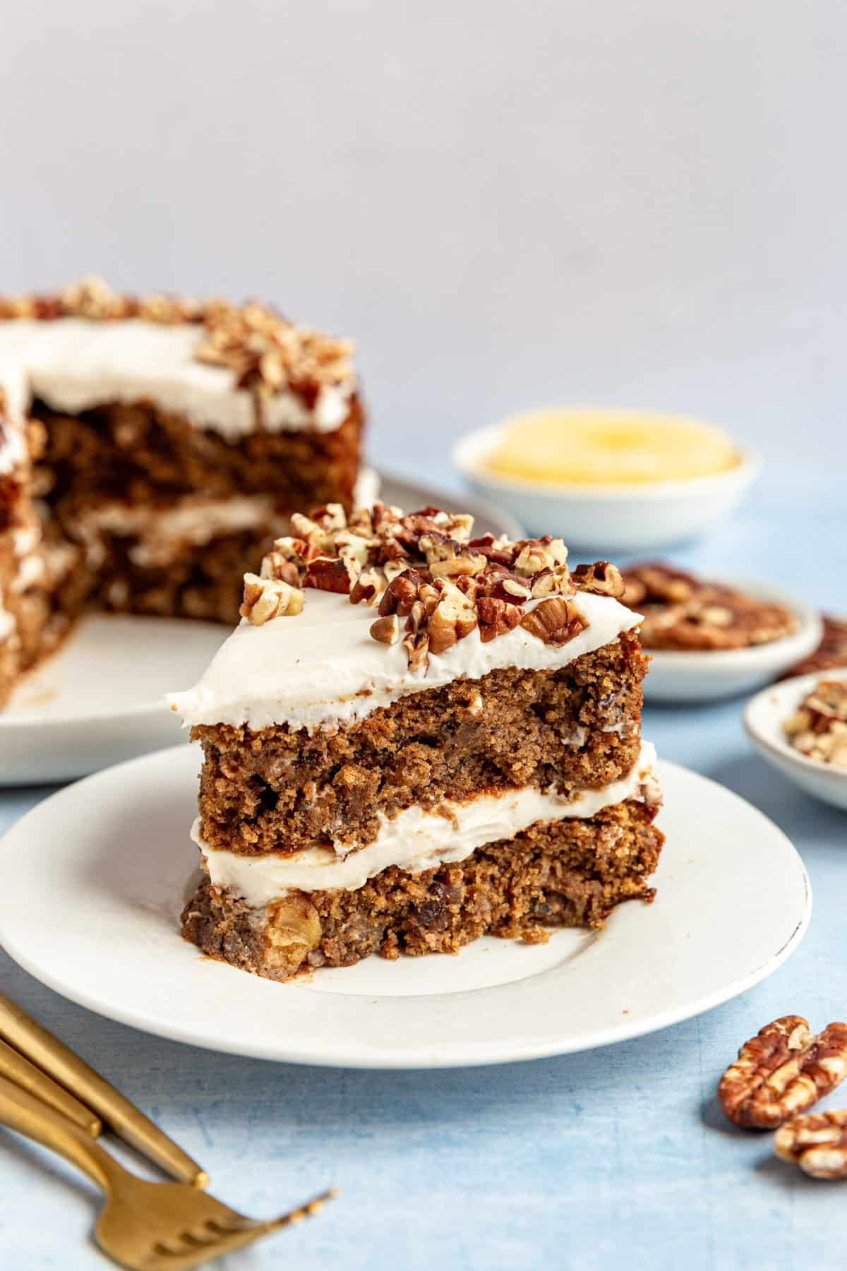 A slice of vegan hummingbird cake, ready to serve.