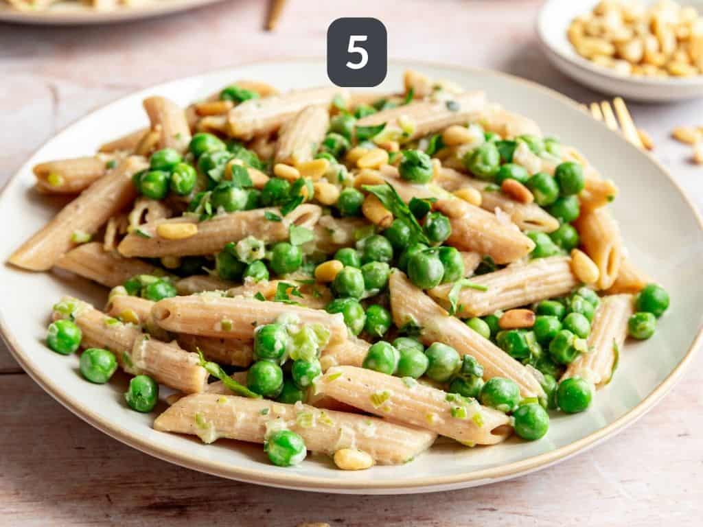 Vegan Pea and Spring Onion Pasta Step 5 - serve with a garnish of pine nuts, parsley, and sea salt.