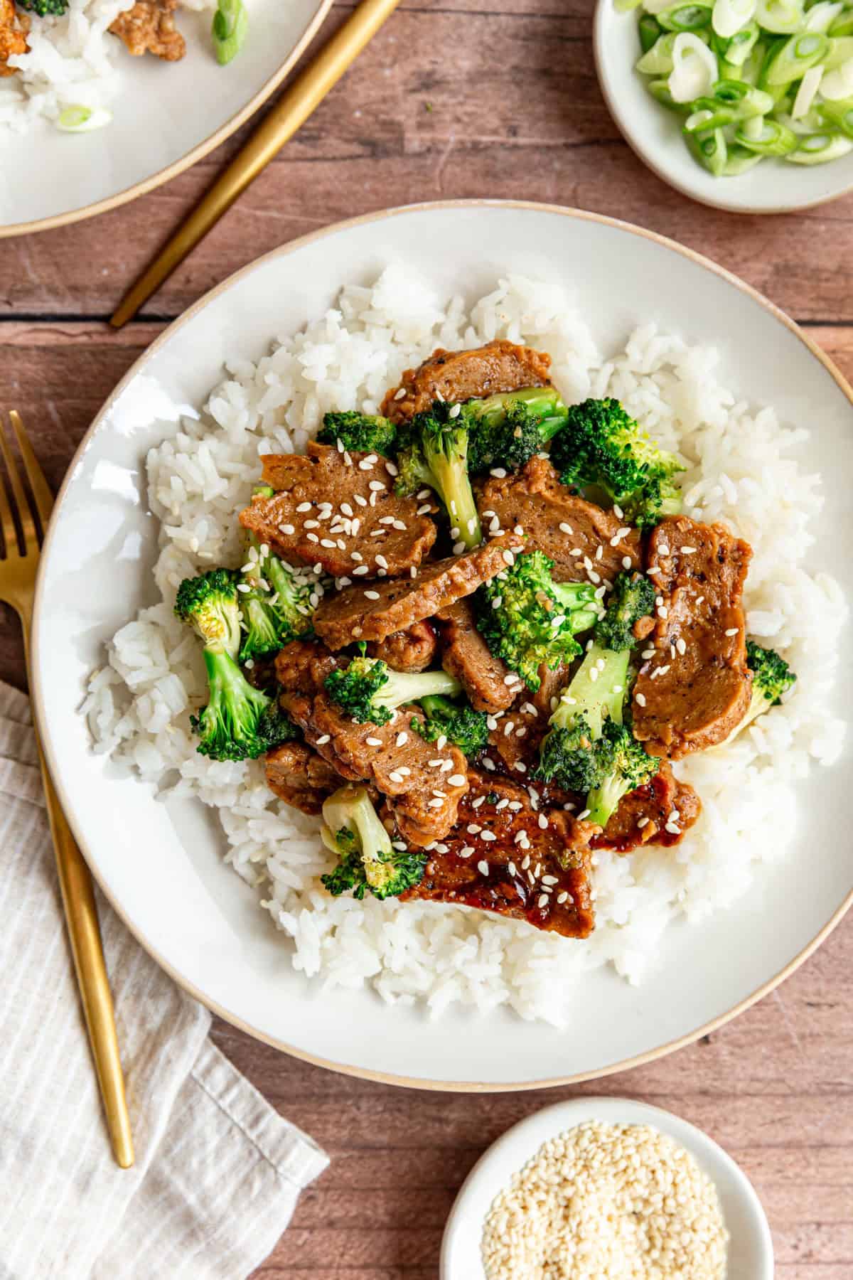 A plate of teriyaki seitan, served over rice.