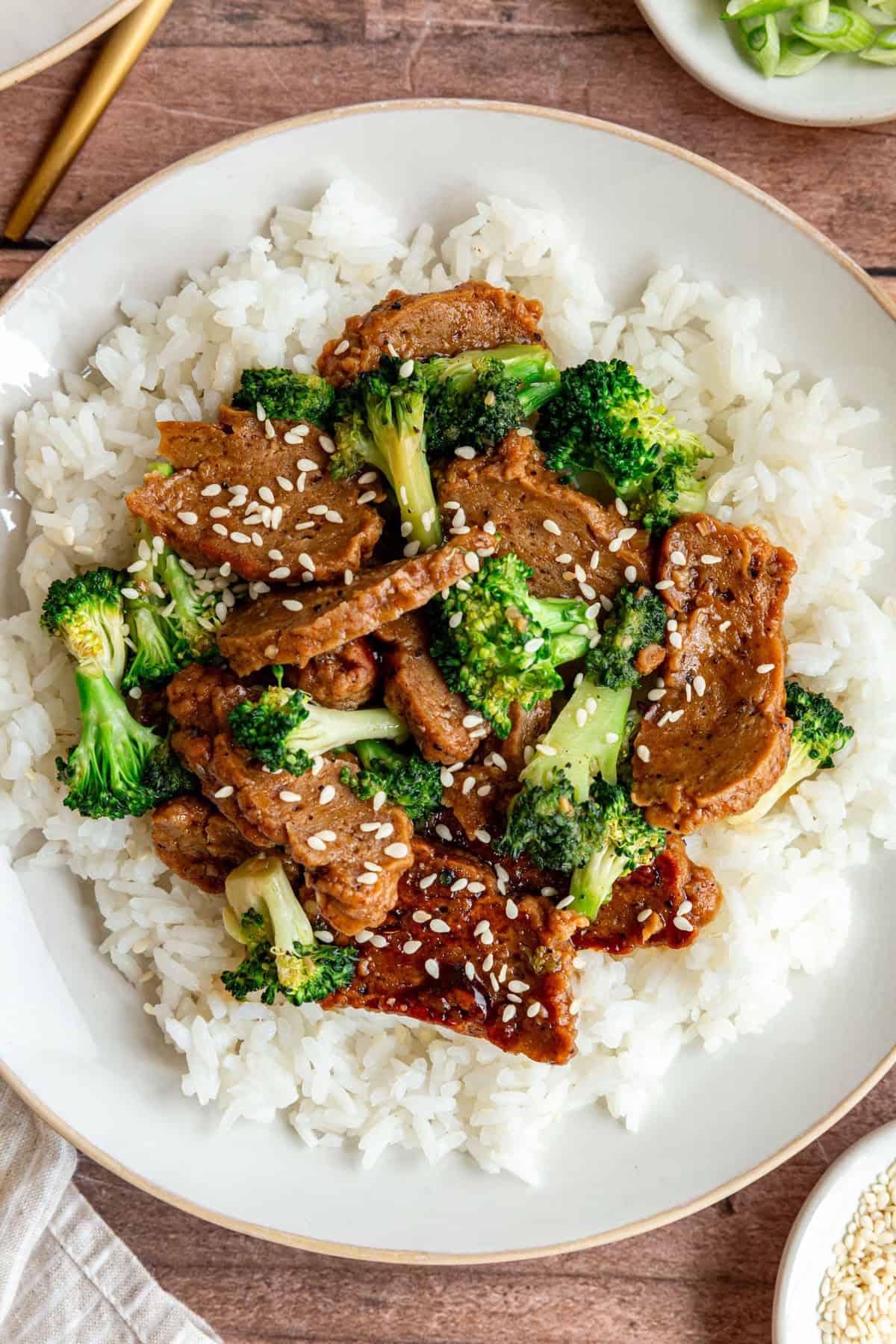 A plate of teriyaki seitan, served over rice.