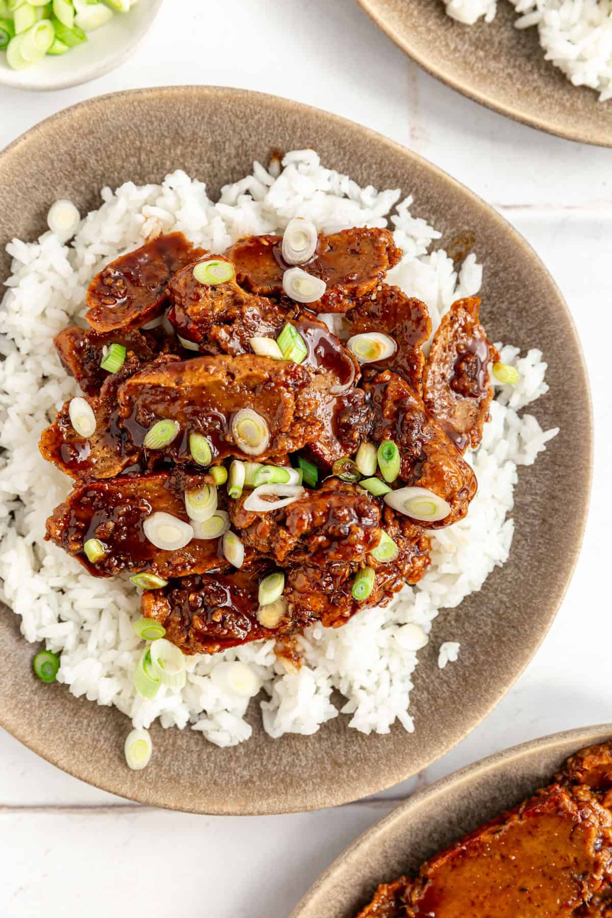 Vegan Mongolian Beef tossed with scallions.