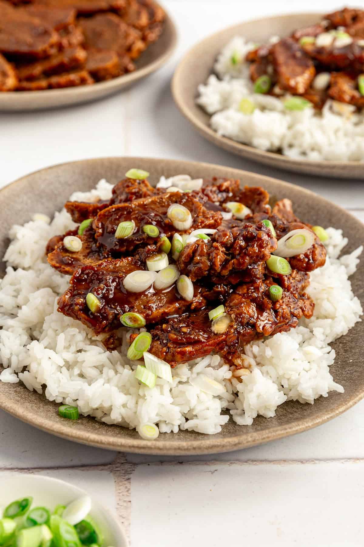 A plate of Vegan Mongolian Beef served over rice.